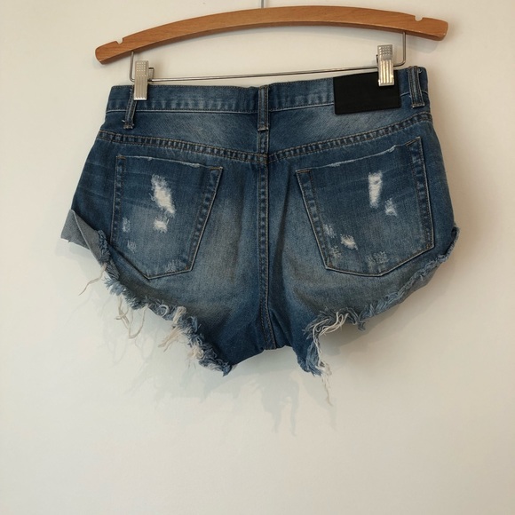 One Teaspoon short jean shorts with distressed ends and button front closure. - Picture 2 of 2